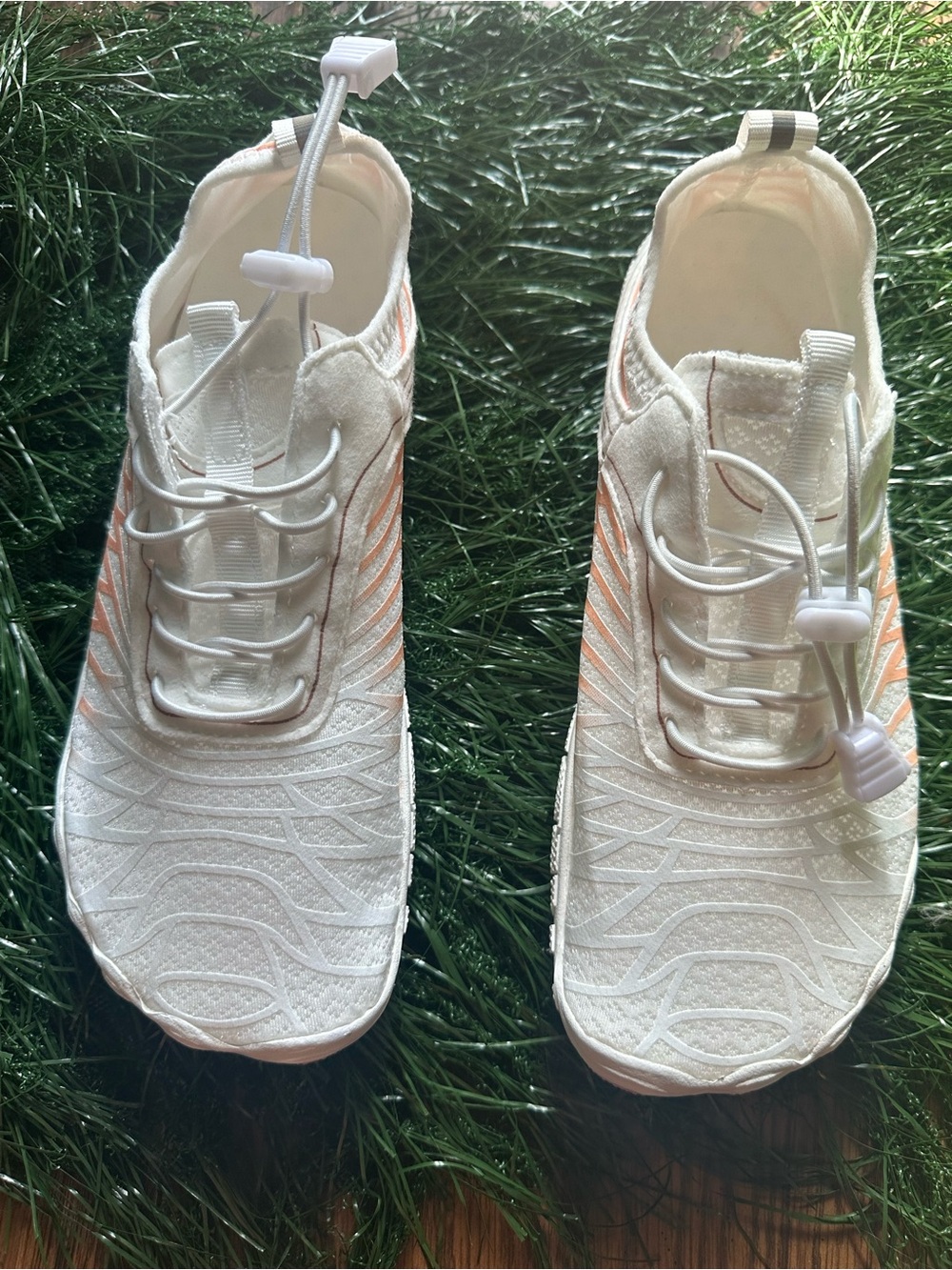 Women’s White Slip-On Athletic Sneakers with Peach Accent